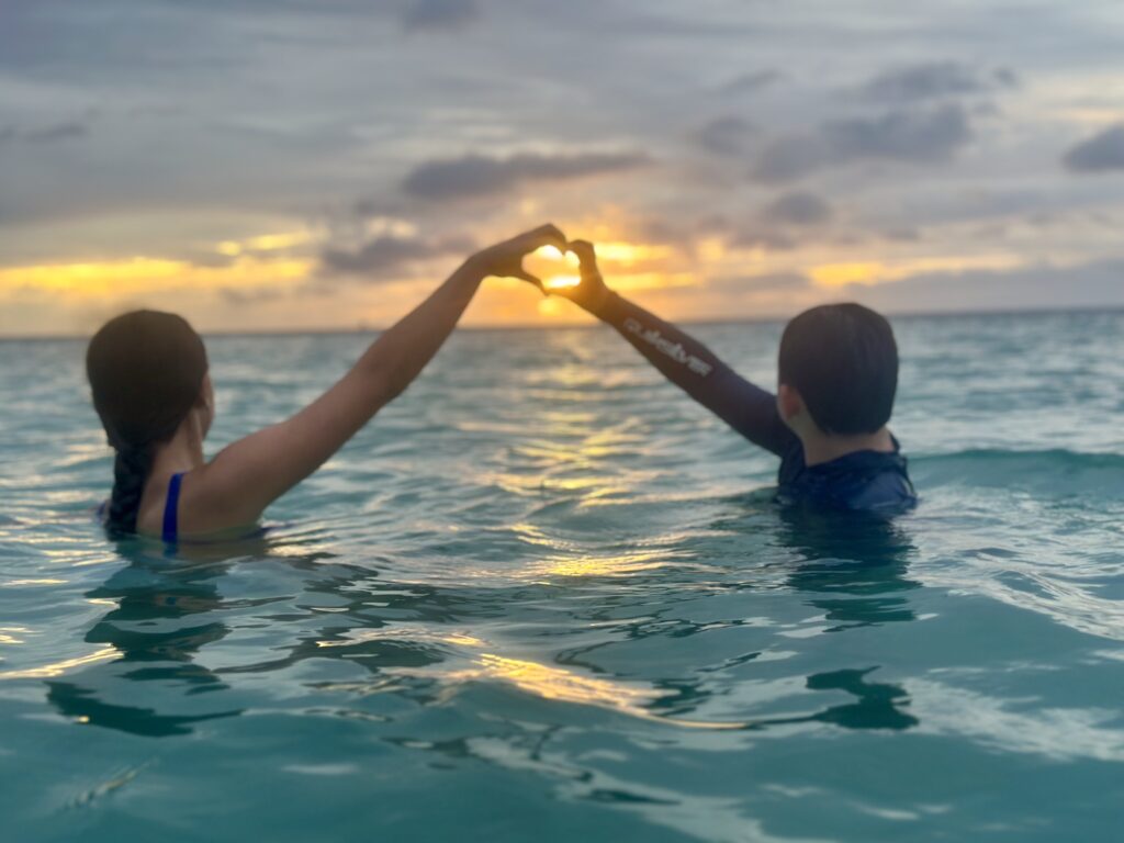 sunset heart hands